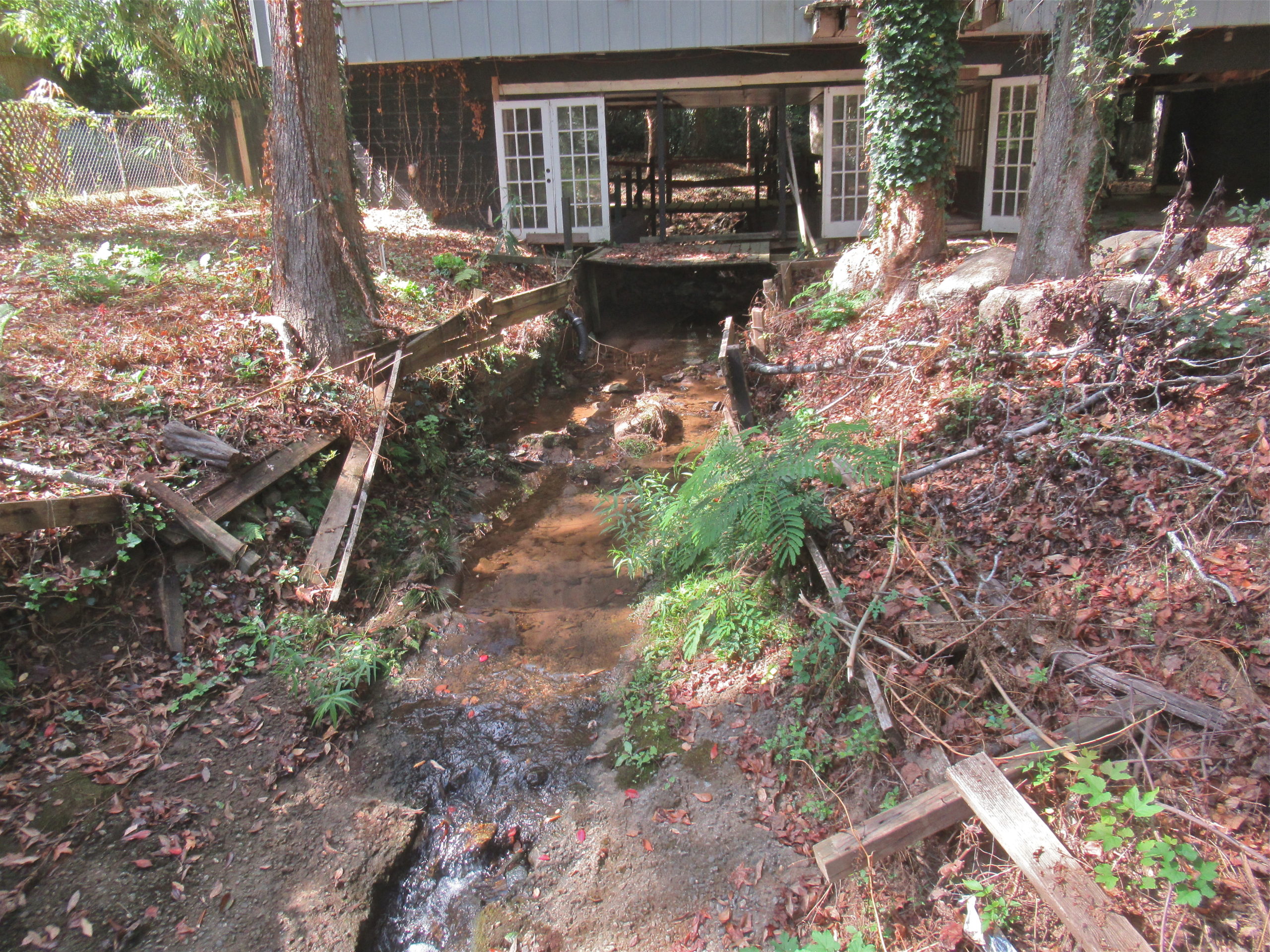 Creek running under a house