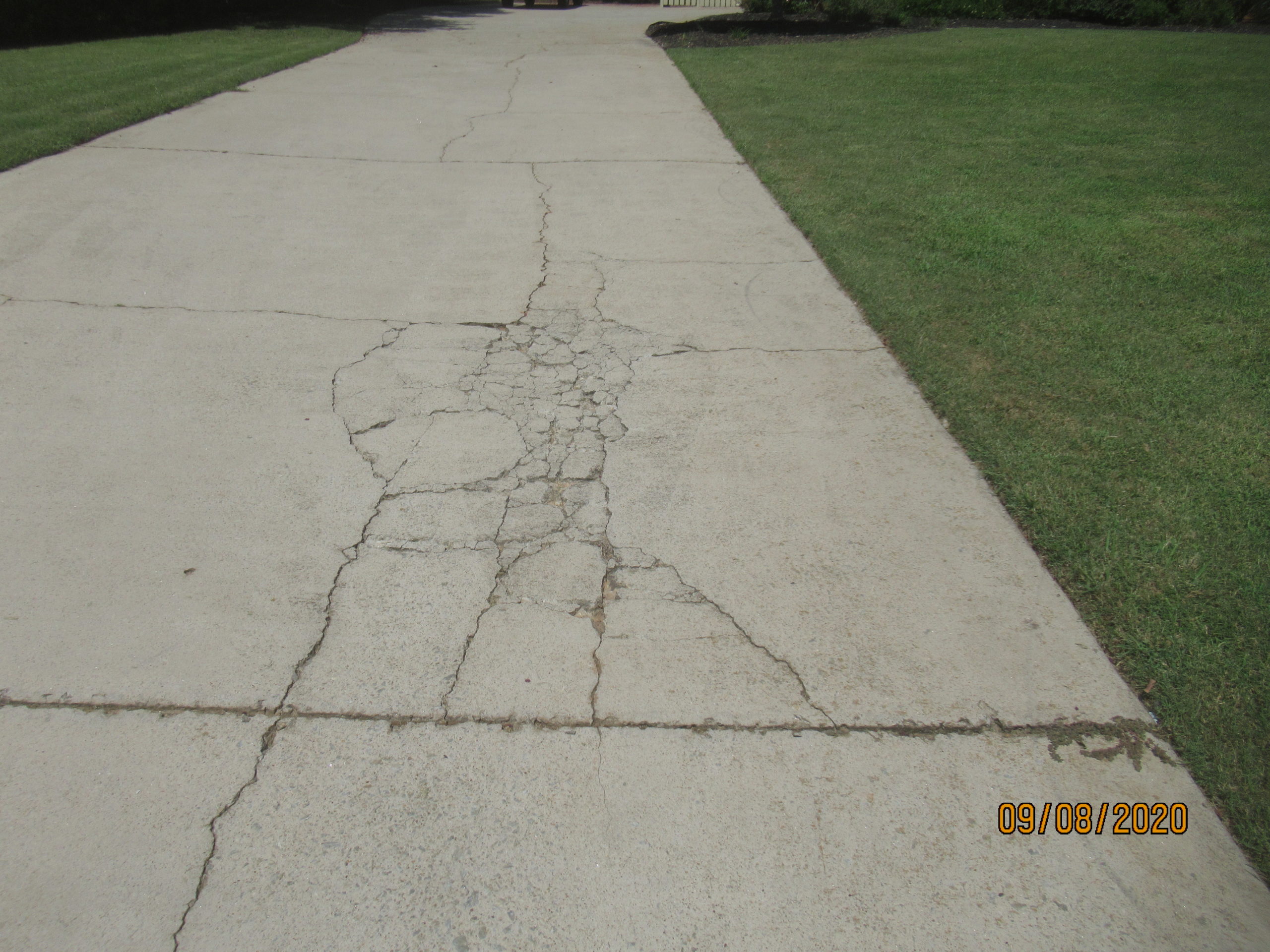 Cracked concrete driveway