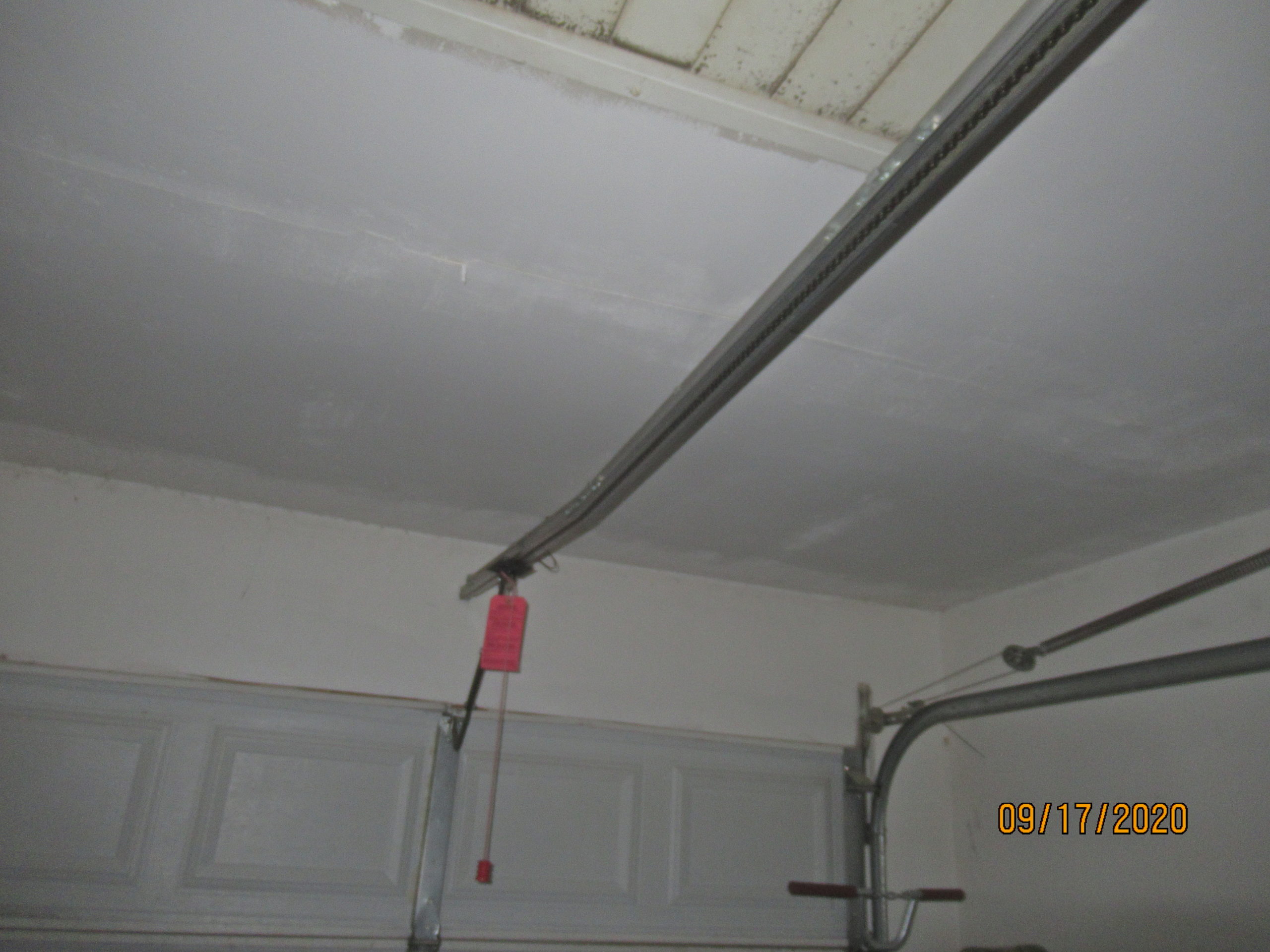Bent garage door belt rail