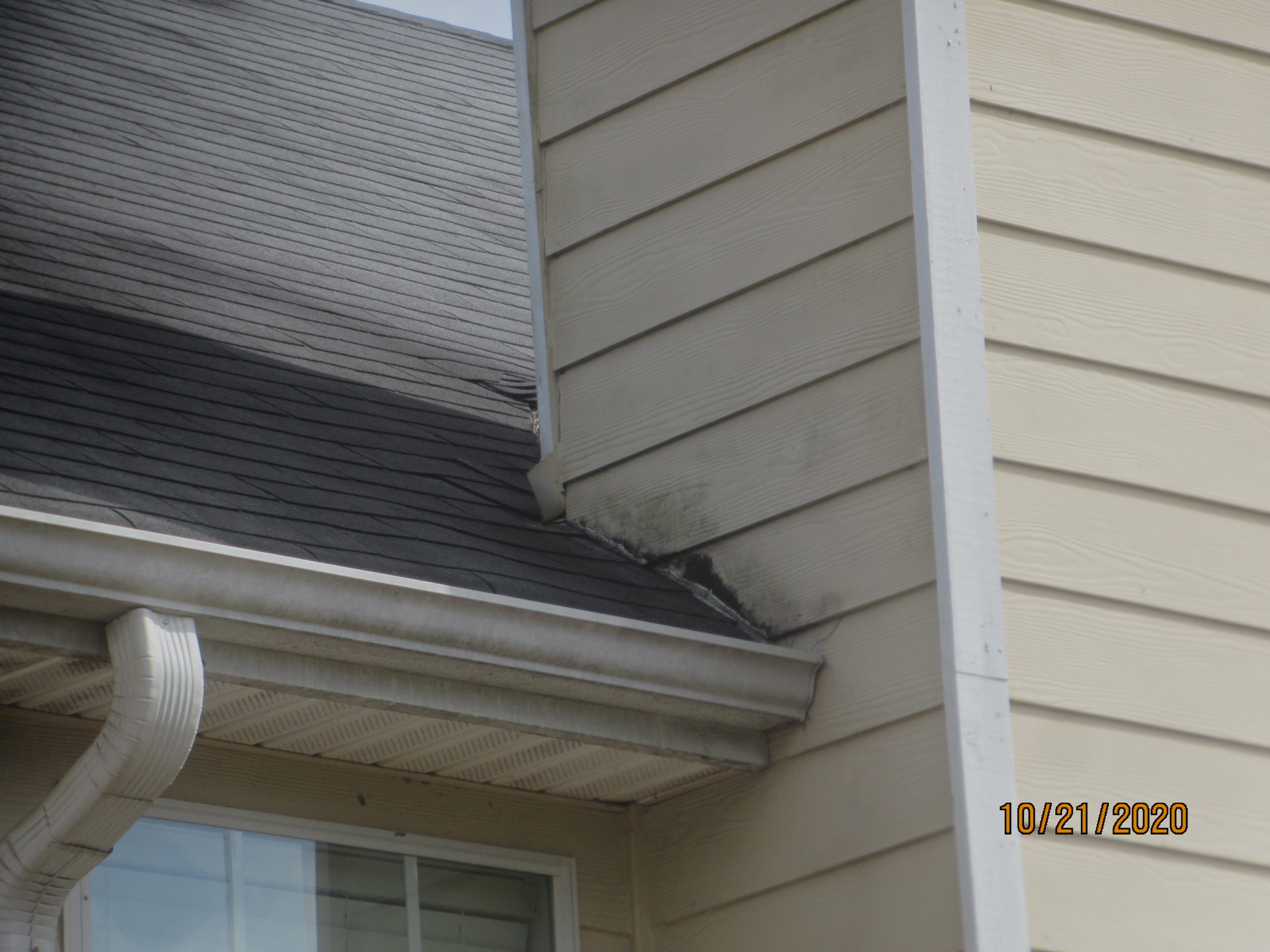 Rot-damaged siding chimney